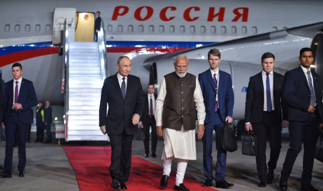 President of the Russian Federation, H.E. Mr. Vladimir Putin received by Prime Minister Shri Narendra Modi upon his arrival in New Delhi for the 23rd India–Russia Annual Summit